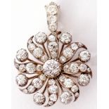 Victorian diamond brooch/pendant of a Catherine Wheel design, the old brilliant cut diamond centre