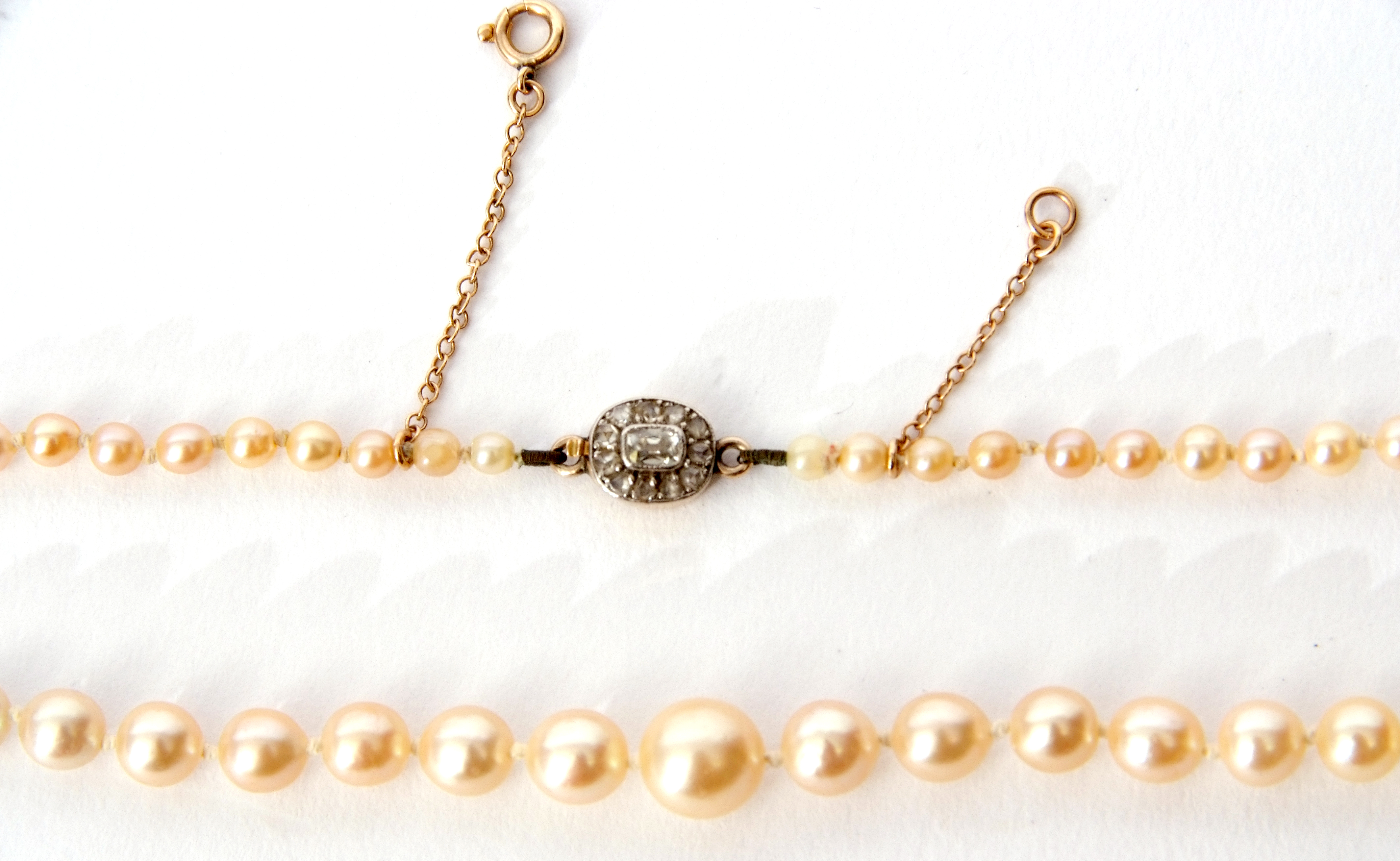 Cultured pearl necklace, a single row of graduated pearls to an old cut diamond clasp, 22cm - Image 2 of 2
