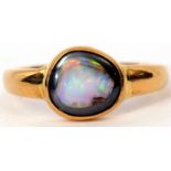 Modern opal doublet ring, bezel set in a plain polished yellow metal mount, 6.6gms gross weight,