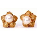 Pair of 18ct gold, pearl and diamond flowerhead earrings, a central pearl raised above five