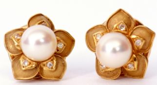 Pair of 18ct gold, pearl and diamond flowerhead earrings, a central pearl raised above five