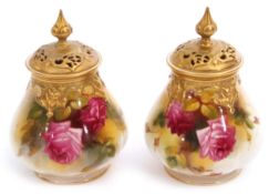 Pair of Royal Worcester pot pourri vases with gilt reticulated covers, painted with roses, one