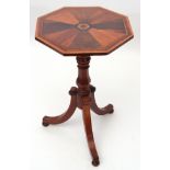 Ornate pedestal table, octagonal top inlaid with radiating exotic wood panels on a ring turned and