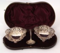 Cased pair of late Victorian large bon-bon dishes of heart shape, pierced and embossed with floral
