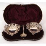 Cased pair of late Victorian large bon-bon dishes of heart shape, pierced and embossed with floral