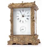 Late 20th century foreign cast brass and glass panelled carriage clock with striking and repeating