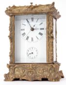 Late 20th century foreign cast brass and glass panelled carriage clock with striking and repeating