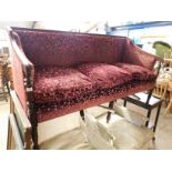 EDWARDIAN MAHOGANY THREE SEATER SOFA WITH RED CUSHIONS AND REEDED LEGS