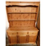 MODERN PINE FRAMED DRESSER, THE TOP FITTED WITH TWO FIXED SHELVES AND PANELLED BACK, THE BASE WITH