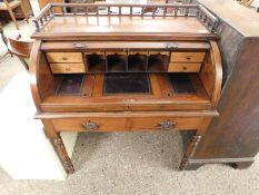 MAHOGANY FRAMED CYLINDER TAMBOUR FRONTED DESK WITH TWO DRAWERS ON RING TURNED LEGS WITH GALLERIED