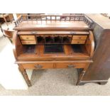 MAHOGANY FRAMED CYLINDER TAMBOUR FRONTED DESK WITH TWO DRAWERS ON RING TURNED LEGS WITH GALLERIED