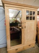 PINE FRAMED DOUBLE DOOR WARDROBE, ONE WITH A MIRROR AND ONE WITH SIX GLASS PANELS INSET WITH TWO