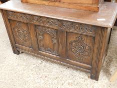 EARLY 20TH CENTURY OAK FRAMED COFFER WITH THREE PANELLED AND CARVED FRONT AND LIFT UP LID