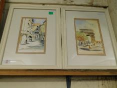 TWO WHITE FRAMED WATERCOLOURS OF STREET SCENES