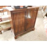 MAHOGANY FRAMED MUSIC CUPBOARD WITH TWO DOORS RAISED ON BRACKET FEET