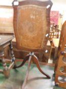 REPRODUCTION MAHOGANY TILT TOP TABLE WITH LEATHER INSERT ON A QUATREFOIL BASE