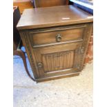 MID-20TH CENTURY OAK FRAMED BEDSIDE CUPBOARD WITH SINGLE DRAWER AND LINENFOLD CUPBOARD DOOR