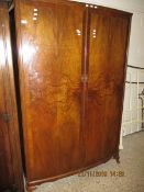 GOOD QUALITY LARGE WALNUT BOW FRONTED DOUBLE DOOR WARDROBE RAISED ON PAD FEET