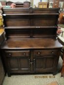DARK STAINED DRESSER, THE TOP FITTED WITH TWO FIXED SHELVES AND PANELLED BACK, THE BASE WITH TWO