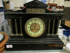 LATE 19TH CENTURY BLACK SLATE GOTHIC STYLE CLOCK, THE CLOCK FACE WITH THREE TURNED METAL COLUMNS