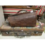 LEATHERETTE GLADSTONE BAG AND A FURTHER VINTAGE LEATHER SUITCASE WITH A QUANTITY OF TRAVEL STICKERS