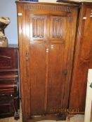 GOOD QUALITY OAK FRAMED SINGLE DOOR WARDROBE WITH CARVED DETAIL