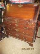 LATE 18TH CENTURY OAK FRAMED DROP FRONTED BUREAU WITH FITTED INTERIOR WITH THREE DRAWERS OVER