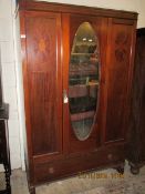 EDWARDIAN MAHOGANY SINGLE DOOR WARDROBE WITH INSET OVAL MIRROR AND INLAID DETAIL WITH FULL WIDTH