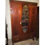 EDWARDIAN MAHOGANY SINGLE DOOR WARDROBE WITH INSET OVAL MIRROR AND INLAID DETAIL WITH FULL WIDTH