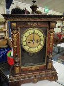 WOODEN BRACKET CLOCK WITH ENAMELLED DIAL AND ROMAN NUMERALS, THE CASE WITH TURNED WOODWORK TO EITHER