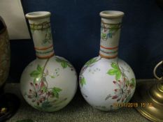 PAIR OF MID-19TH CENTURY STONEWARE VASES, THE BALUSTER BODIES DECORATED WITH A PAINTED FLORAL DESIGN