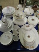 QUANTITY OF WEDGWOOD MOSS ROSE DINNER WARES AND A ROYAL DOULTON PILLAR ROSE PART DINNER SET (2)