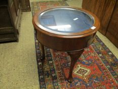 MAHOGANY FRAMED CIRCULAR COFFEE TABLE ON THREE PAD FEET