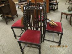 SET OF FOUR EARLY 20TH CENTURY OAK FRAMED DINING CHAIRS WITH RED DRALON DROP IN SEATS AND BARLEY
