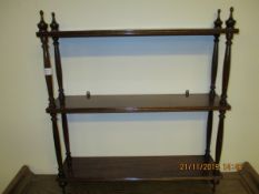 MAHOGANY FRAMED THREE TIER SHELF UNIT WITH TURNED COLUMN SUPPORTS