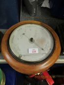 CIRCULAR BAROMETER IN A WALNUT FRAME, 27CM DIAM