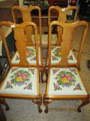 SET OF FOUR BEECHWOOD FRAMED SPLAT BACK DINING CHAIRS WITH EMBROIDERED SEATS AND PAD FRONT FEET