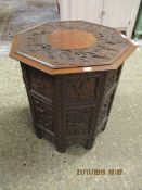EASTERN CARVED HEXAGONAL MOORISH TYPE TABLE WITH CARVED PANEL FOLDING BASE