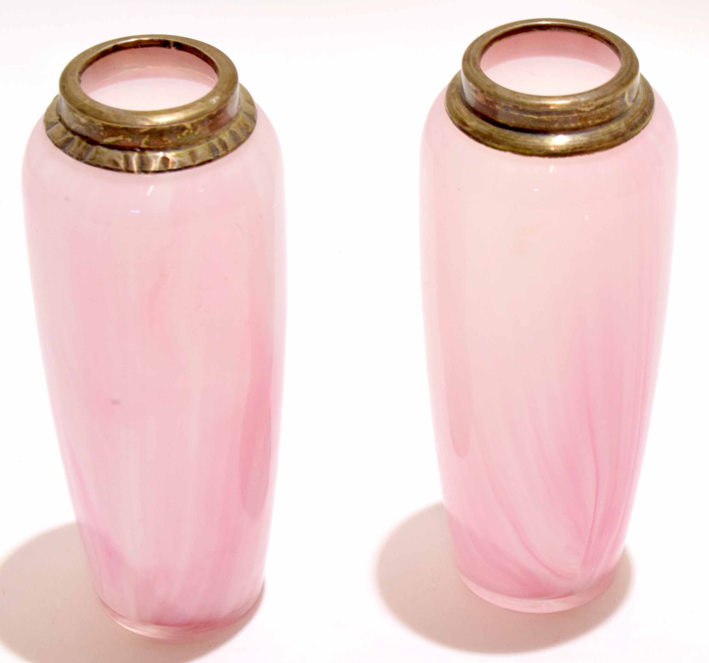 Pair of pink coloured glass vases with a streaked design, the vases with silver rims, 16cm high (2)