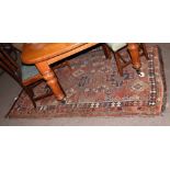 Caucasian wool carpet, central panel of three geometric large lozenges, mainly puce, rust and