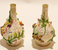 Pair of Coalport vases, the bodies with a floral design in relief, blue factory mark to one vase,