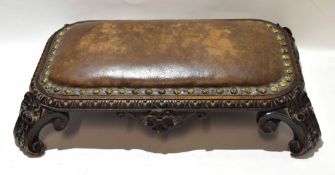 Unusual oak foot stool, leatherette brass studded top over four splayed c-scroll feet, inscribed