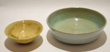 Chinese Longquan celadon dish with typical glaze, together with a further Chinese pottery dish