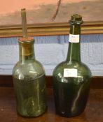 Two vintage wine bottles now converted to table lamps