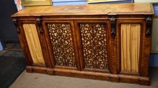 Victorian walnut credenza, of plain top over two central fretwork carved moulded doors enclosing