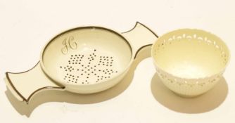 Late 18th century Wedgwood cream ware strainer with monogram, together with a small cream ware tea