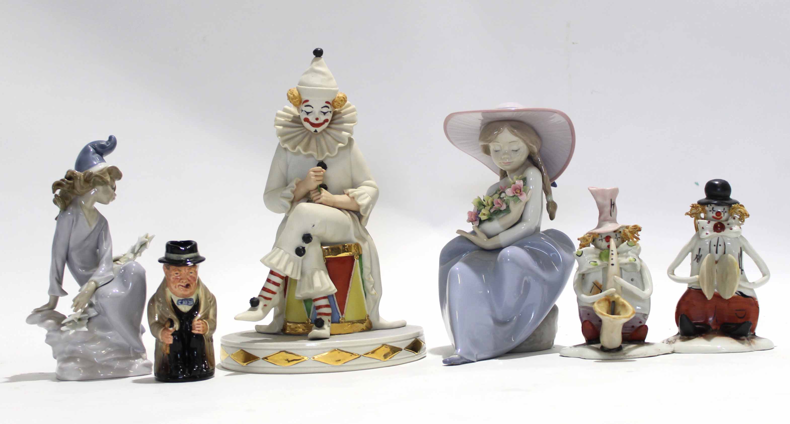 Group of Lladro and Capo di Monte figures including a Lladro figure of a young girl holding flowers,