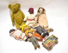 Collection of early 20th century dolls and a small carriage containing wooden bricks, the dolls