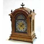 Early 20th century cast brass mounted walnut mantel clock, the arched case with overhanging