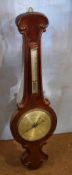 19th century mahogany wheel barometer, scroll pediment over silvered vernier, similar face below (